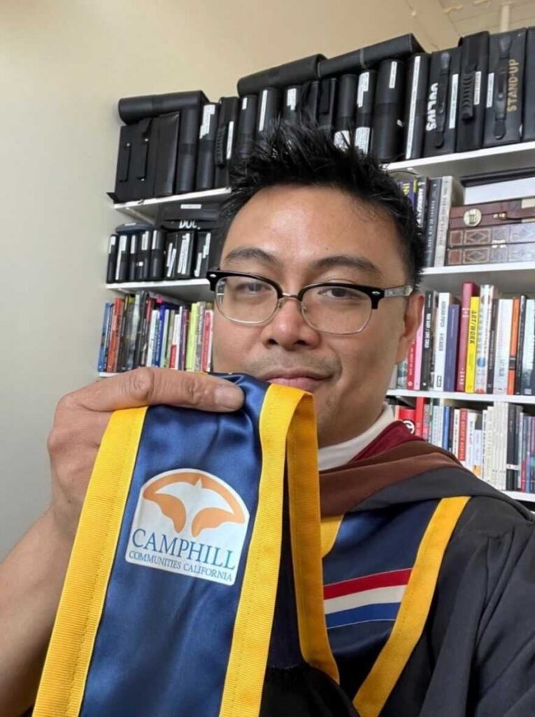 Julius displaying his Camphill patch on his Graduation Stole