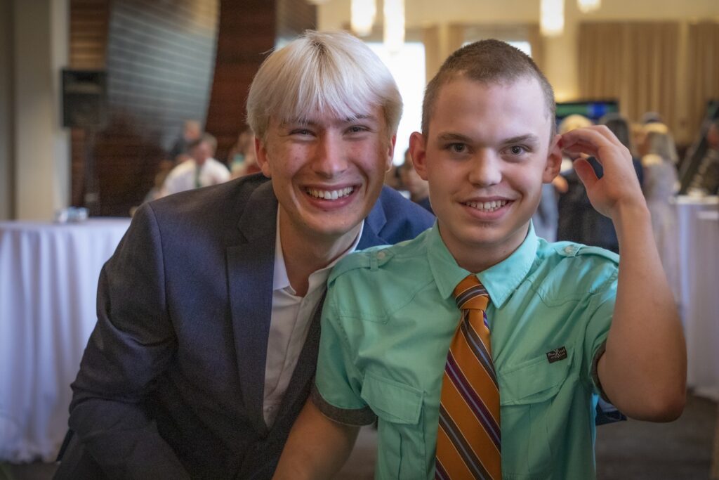 Two people smiling for the camera together