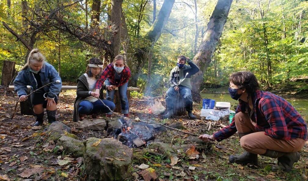 Roasting marshmallows by the river at Beaver Farm