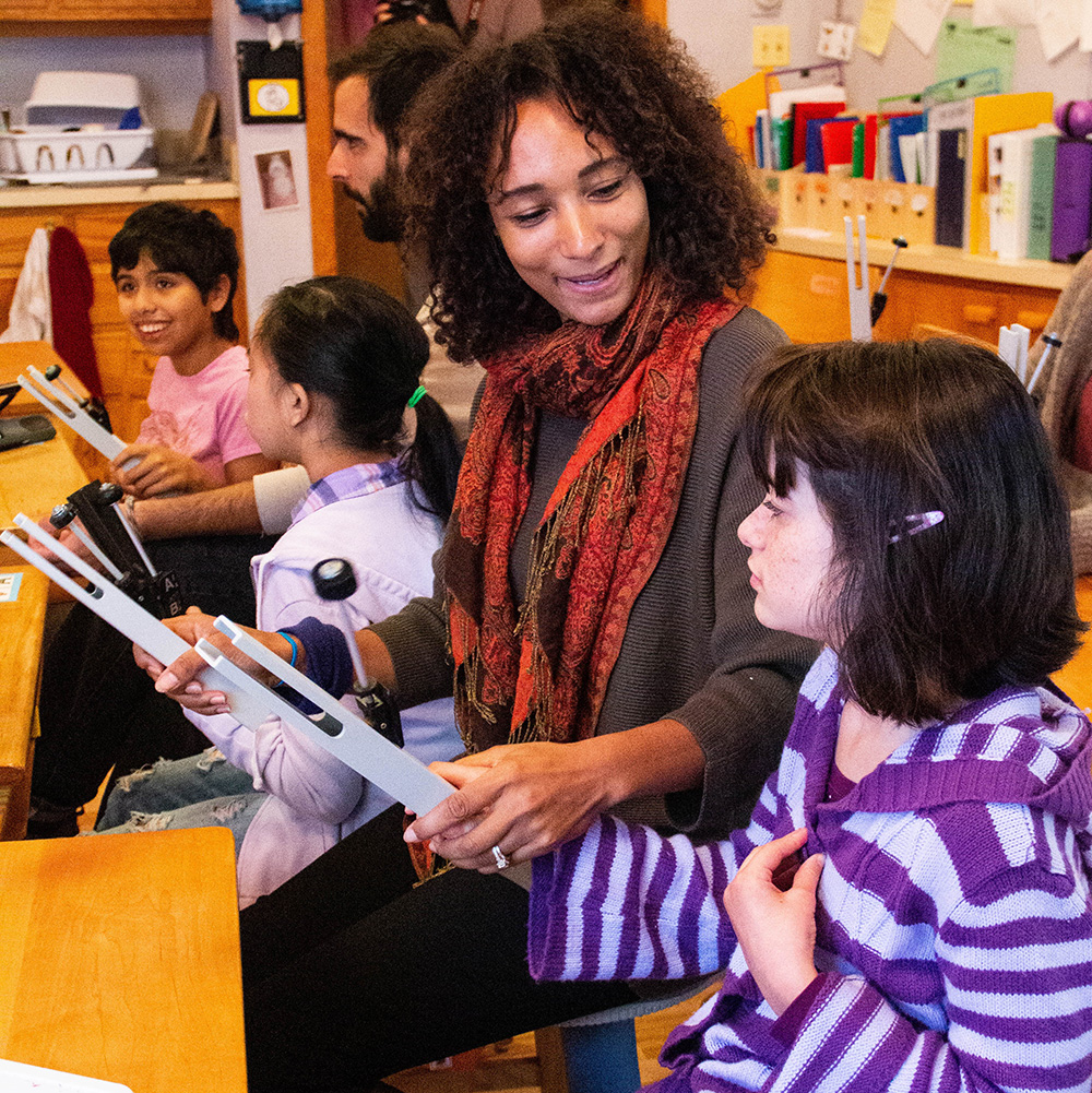 Teachers and students working together in a classroom