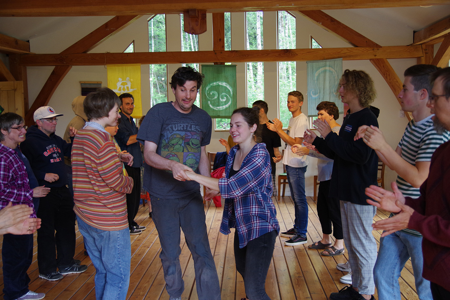 People dancing indoors at Camphill