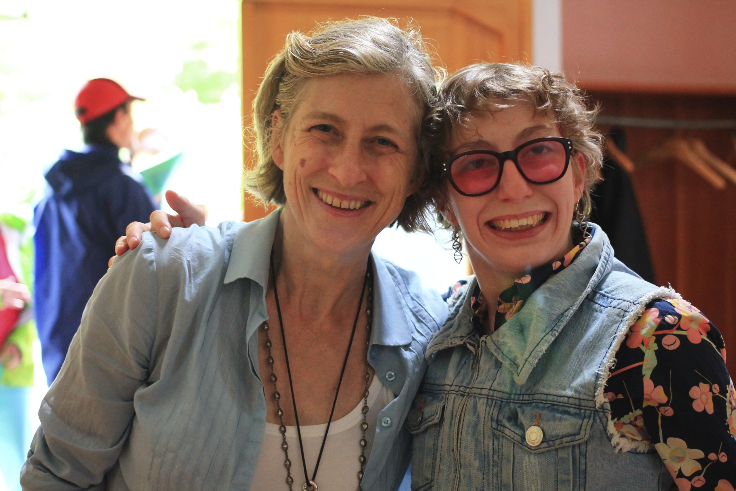 Two women hugging each other and smiling