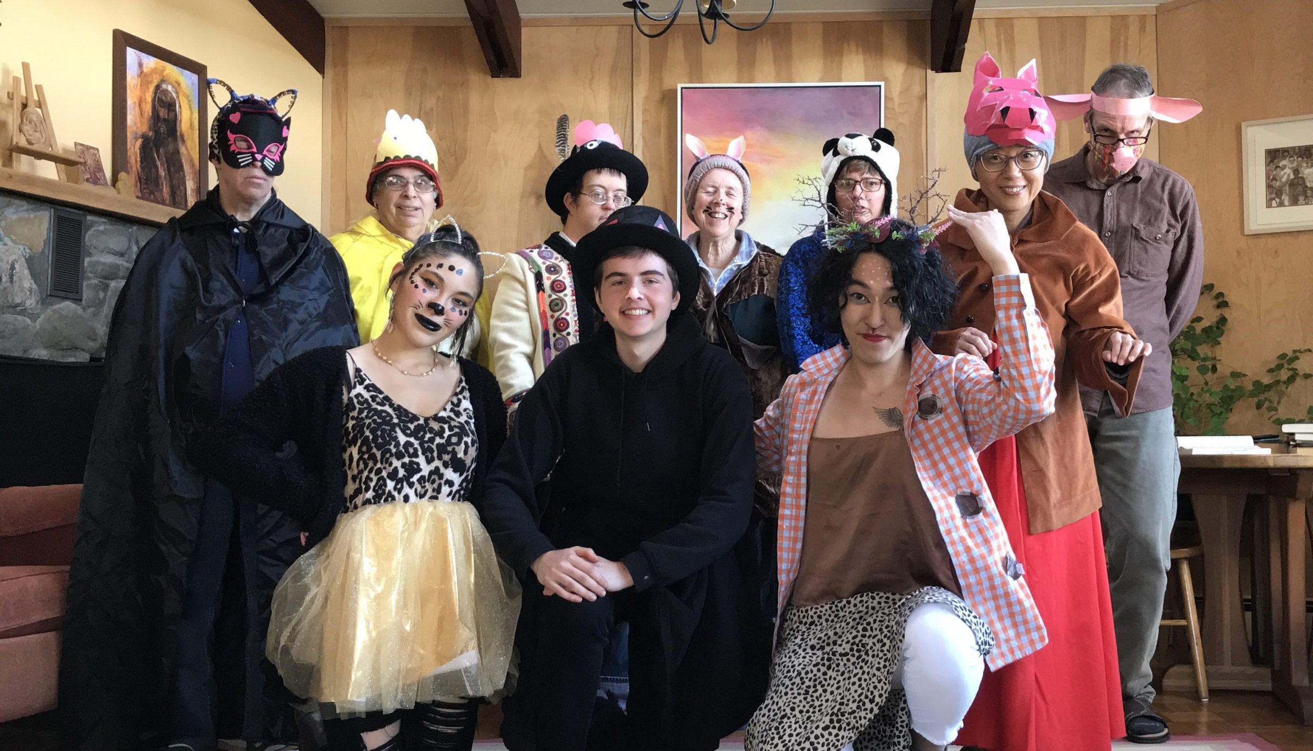 Ike and his Camphill friends smiling in their Halloween costumes.