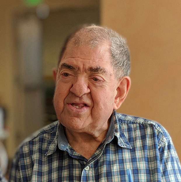 An older man smiling