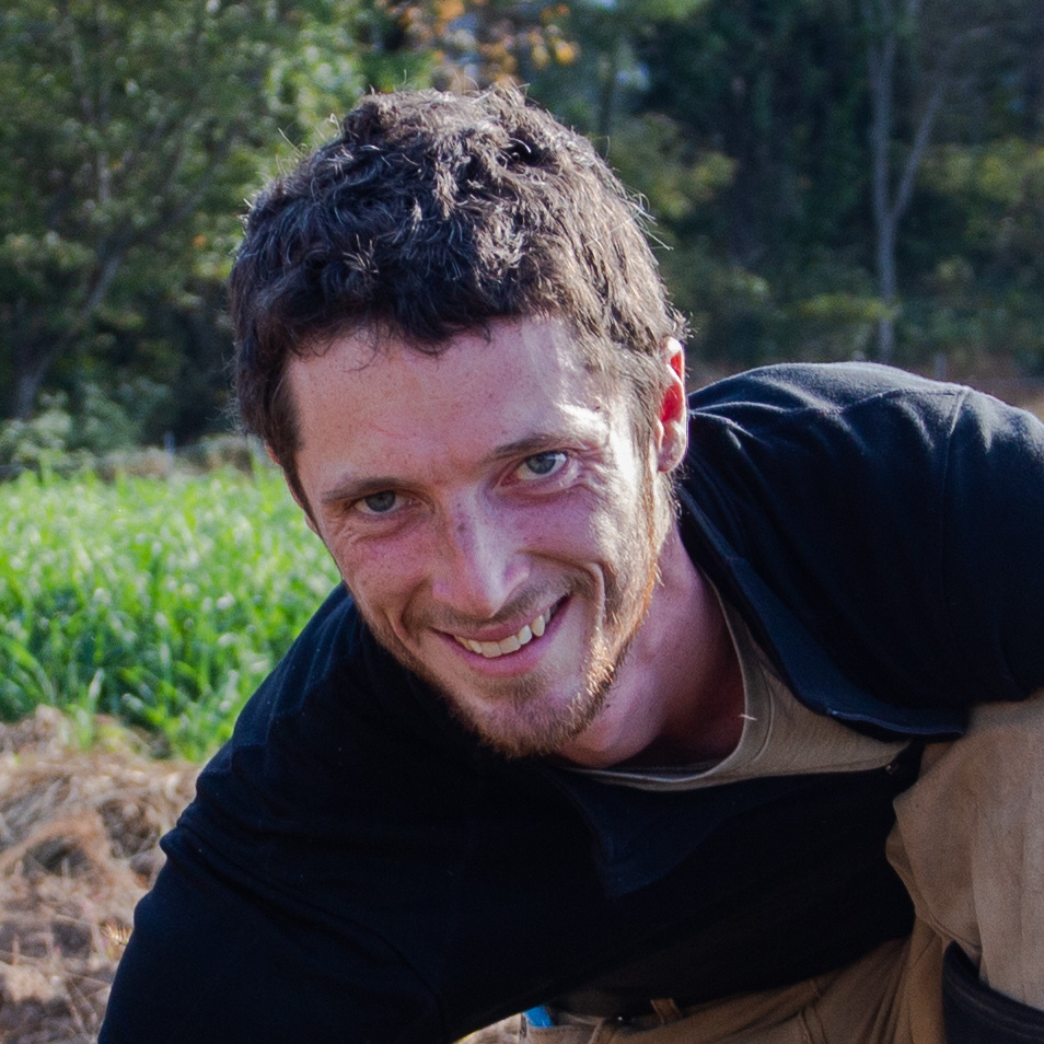 A man smiles at the camera